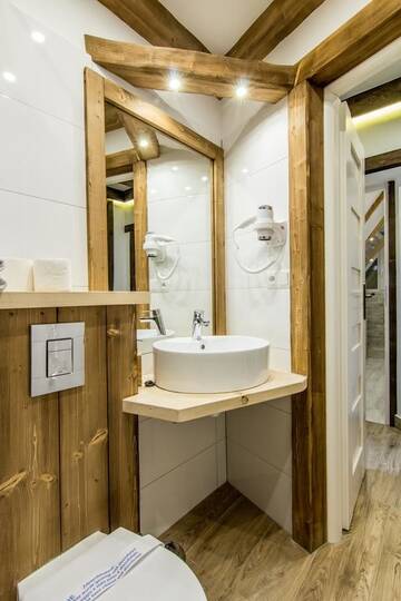 Фото номера Апартаменты с 3 спальнями и балконом Апартаменты Apartamenty Gronik Zakopane г. Косцелиско 24