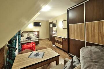 Фото номера Четырехместный номер с видом на горы Апарт-отели Apartamenty Kościelisko г. Косцелиско 6
