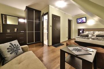 Фото номера Четырехместный номер Делюкс Апарт-отели Apartamenty Kościelisko г. Косцелиско 2