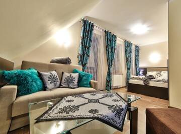 Фото номера Семейный номер с видом на горы Апарт-отели Apartamenty Kościelisko г. Косцелиско 2